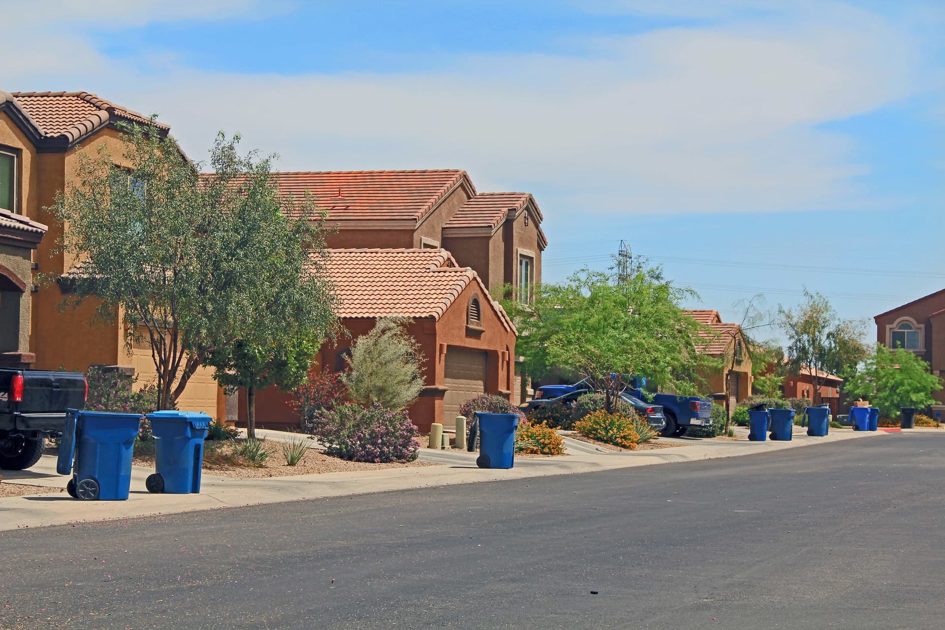 Arizona residential street of stucco homes with desert landscaping
