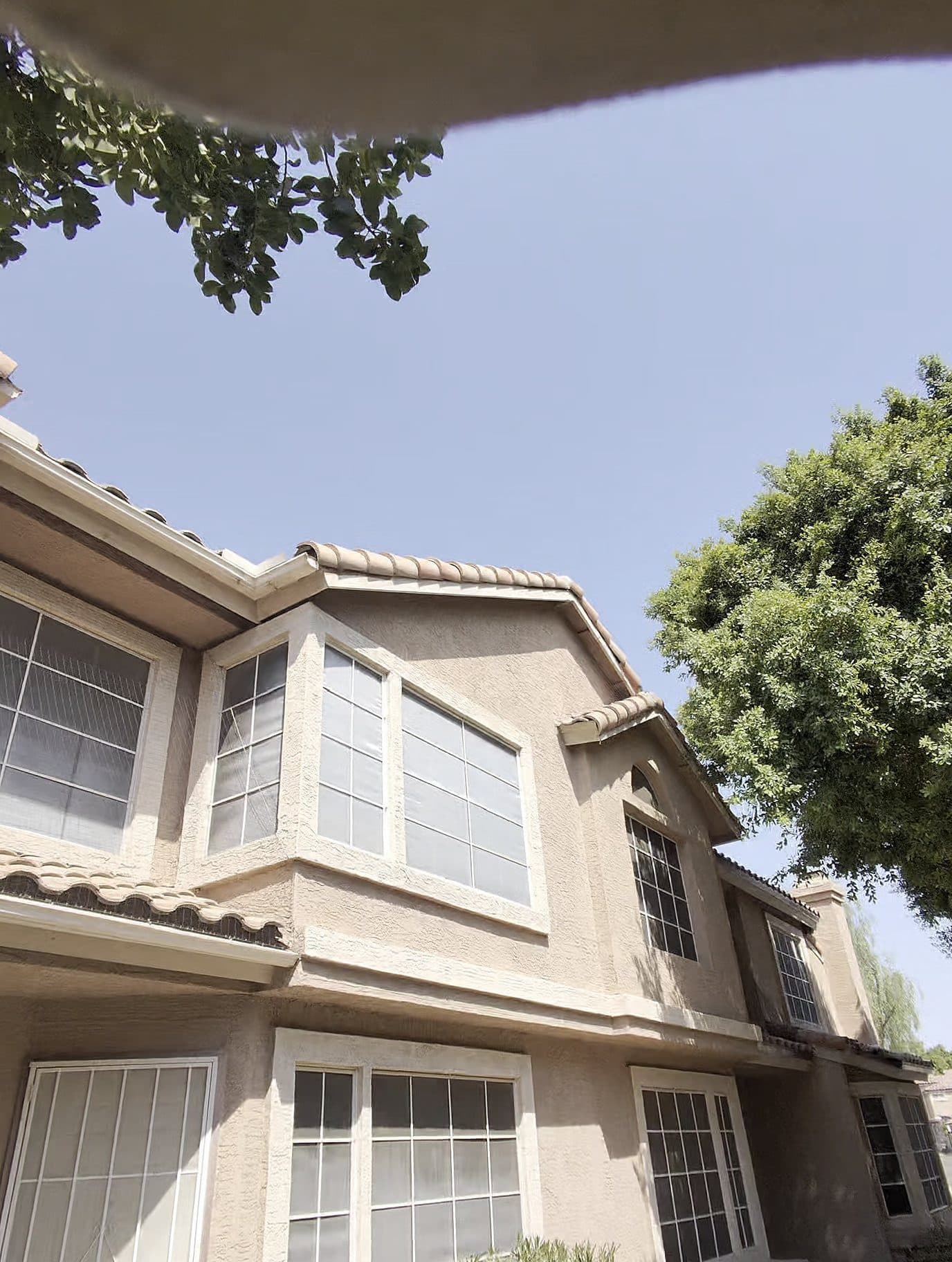 Two-story building exterior and roofline in the Valley